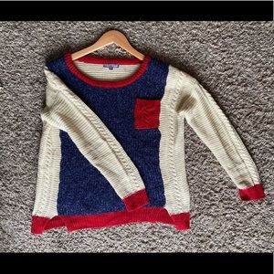 Blue and white with red accent sweater.